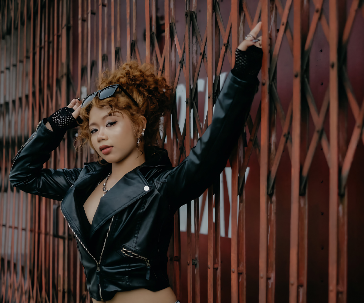 Dhafney in a black leather outfit