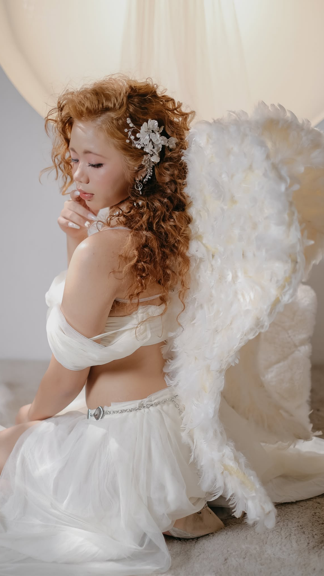 Dhafney in white with angel wings